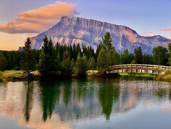 Scenic view of lake and mountains against sky