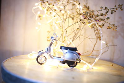 Close-up of flower vase on table at home