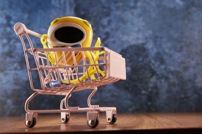 Close-up of miniature shopping cart