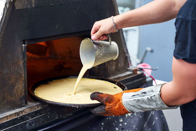 Midsection of man preparing food