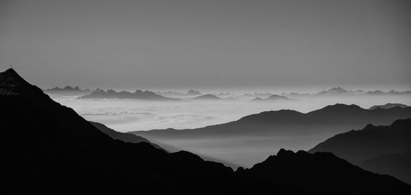 Scenic view of mountains against dramatic sky