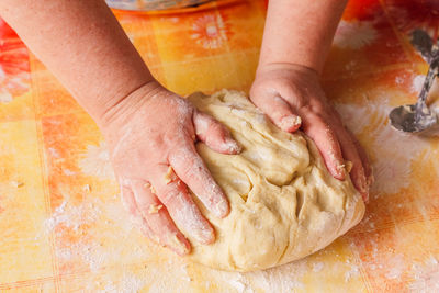 Low section of person preparing food