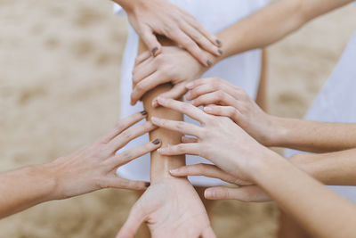 Midsection of couple holding hands