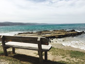 Empty bench on beach