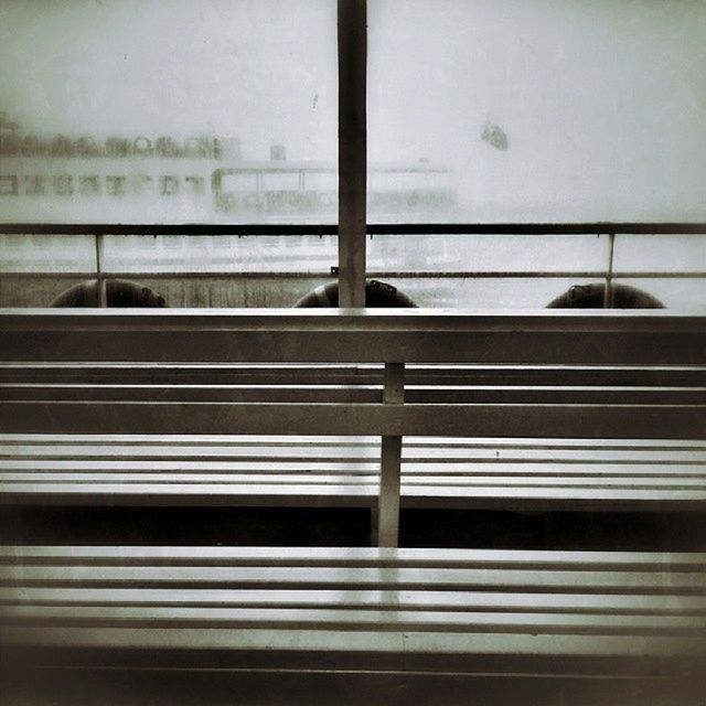 window, glass - material, transparent, indoors, looking through window, railing, glass, reflection, day, no people, window sill, transportation, water, animal themes, built structure, metal, close-up, architecture, nature, sky