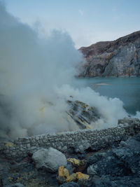 Smoke emitting from volcanic mountain