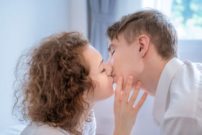 Portrait of couple kissing