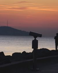  island scenic view of sea against sky during sunset