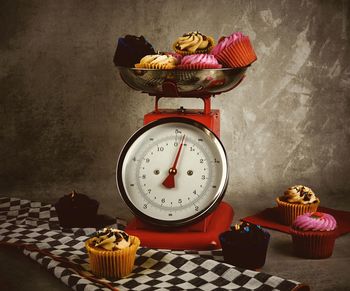 High angle view of clock on table