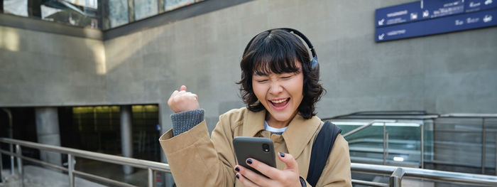 Young woman using mobile phone