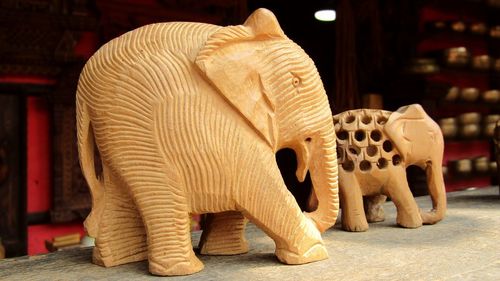 Close-up of elephant statue on table