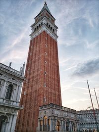 Low angle view of clock tower against sky