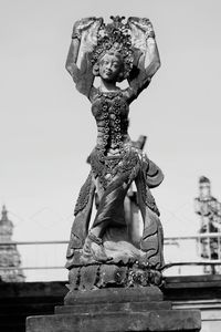 Low angle view of statue against sky