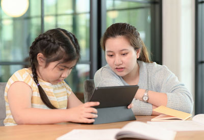 Young woman using laptop at home