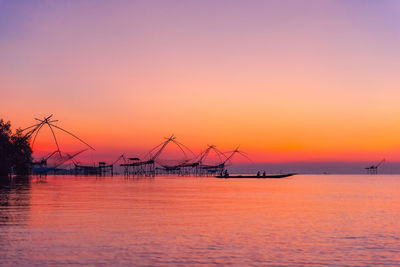 Beautiful sunrise at pakpra canal, vintage bamboo fish trap machine