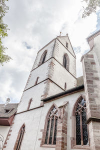 Low angle view of bell tower against sky