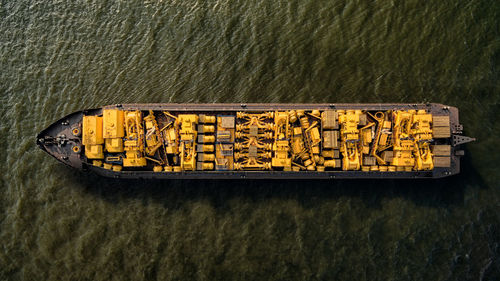 High angle view of yellow equipments on ship