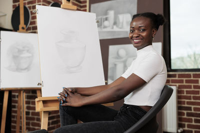 Portrait of young woman using mobile phone