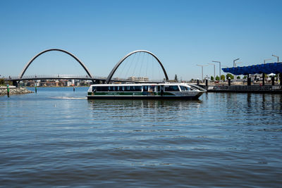 View of bridge over river against clear sky