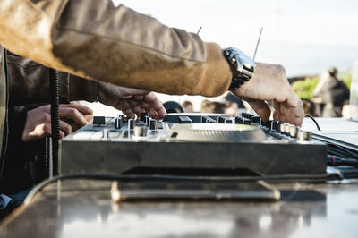 Close-up of man playing piano