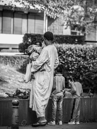 Rear view of couple standing outdoors