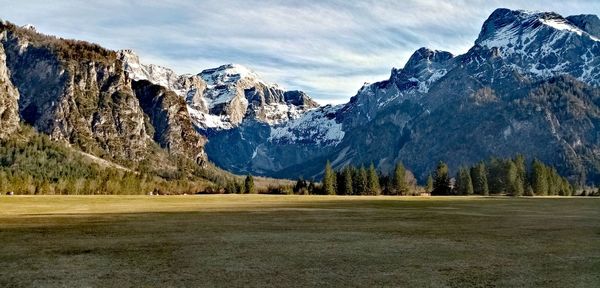 Scenic view of snowcapped mountains against sky