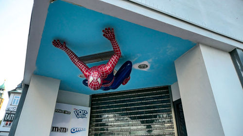 Low angle view of decorations hanging on building