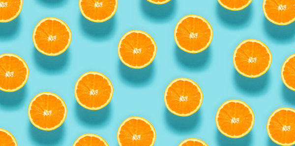 Directly above shot of orange fruits against white background