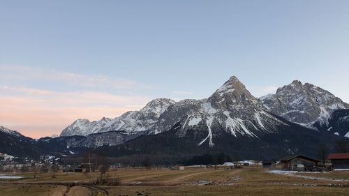 Scenic view of snowcapped mountains against clear sky