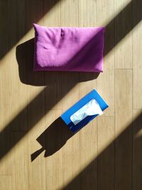 Purple pillow and tissue box