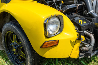 Close-up of yellow vintage car parked