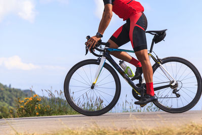 Side view of a man riding bicycle