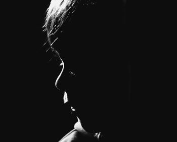 Blurred motion of man over black background