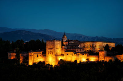 Buildings against sky at night