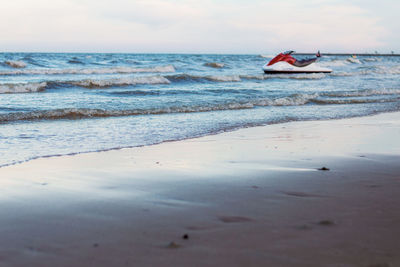 Boat in sea against sky