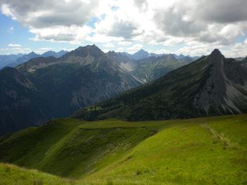 Scenic view of landscape against cloudy sky