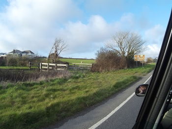 Road passing through field