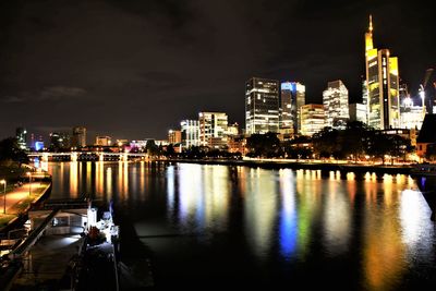 Illuminated city at waterfront