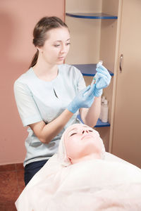 Young woman lying down on floor