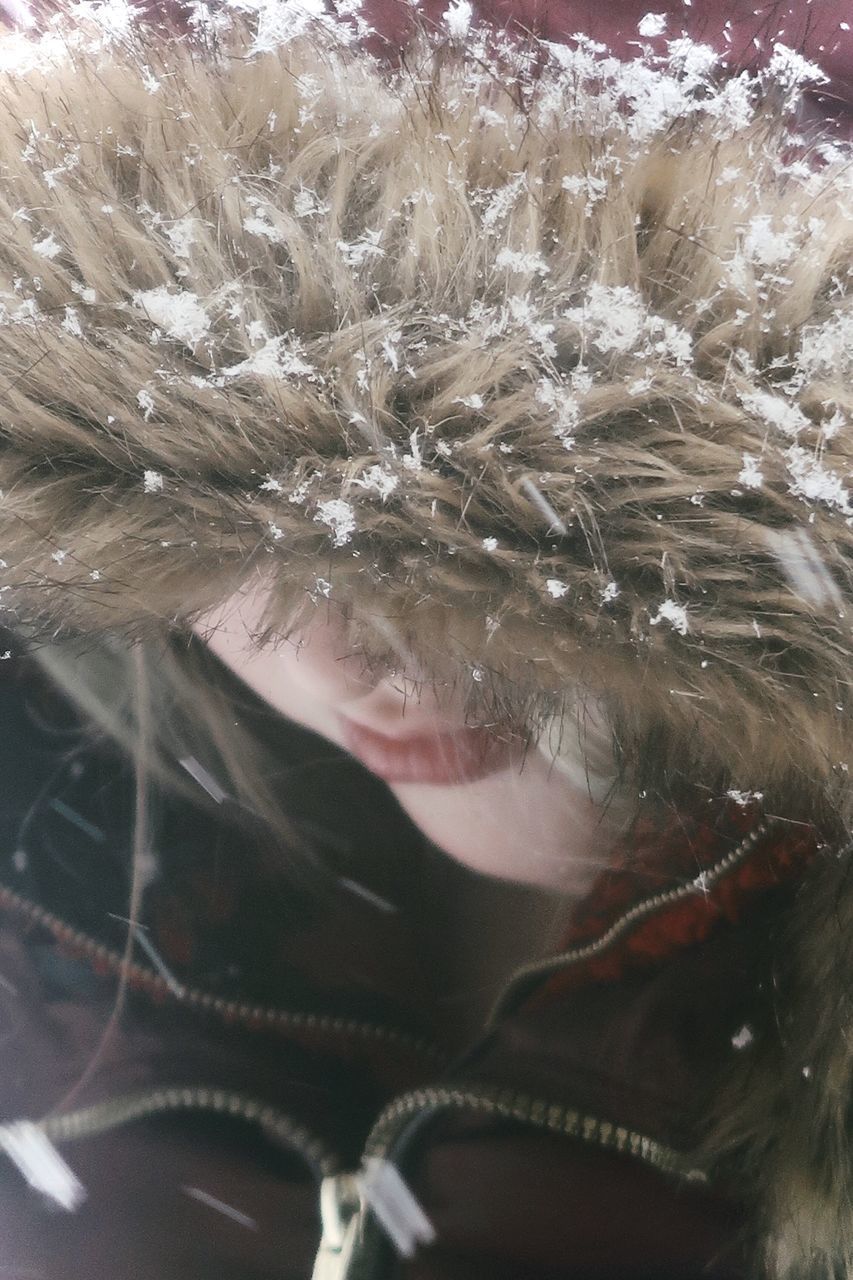 CLOSE-UP PORTRAIT OF WOMAN IN SNOW COVERED WITH ICE