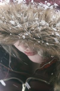 Close-up portrait of woman in snow