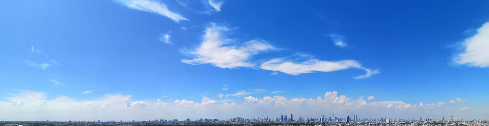 Low angle view of land against blue sky