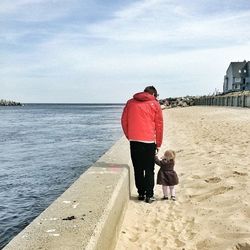 Full length of woman standing on beach