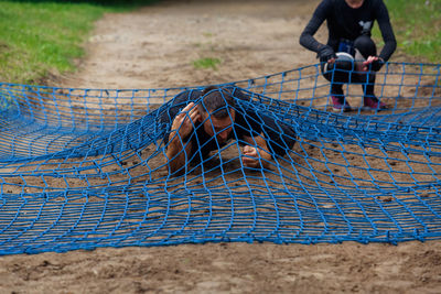 Low section of boy playing on land