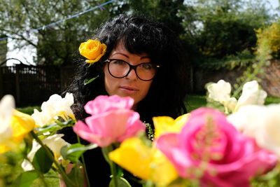 Portrait of woman with red roses