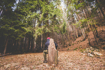 Man hiker thinking in the forest in mountain - time to disconnect concept