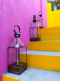 Multi colored umbrella on wall of building