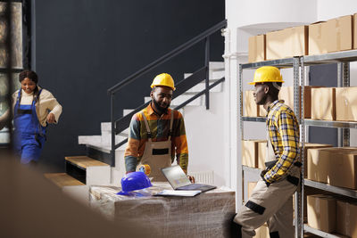 Rear view of man working at home