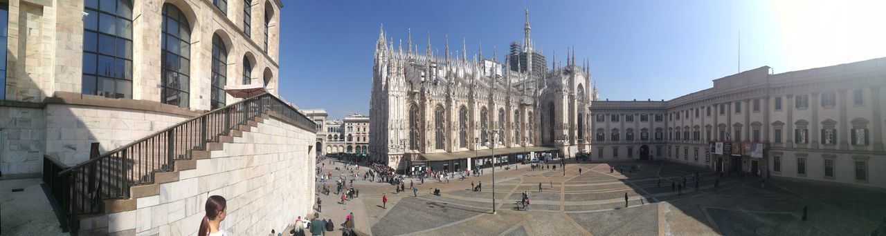 architecture, building exterior, built structure, real people, large group of people, sunlight, travel destinations, women, outdoors, clear sky, day, city, men, sky, people