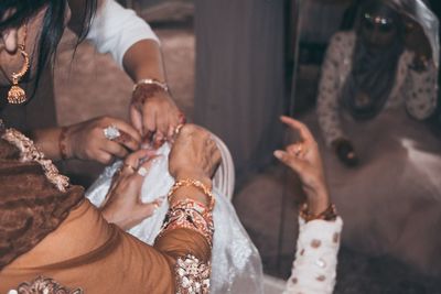 Midsection of woman holding hands